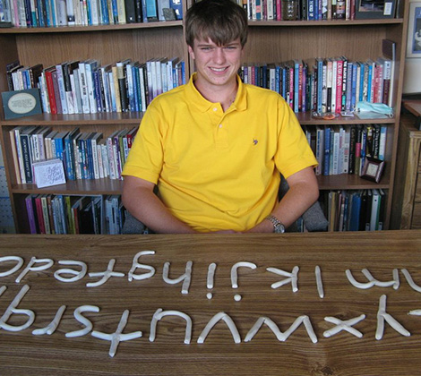 Young Man With Clay Letters